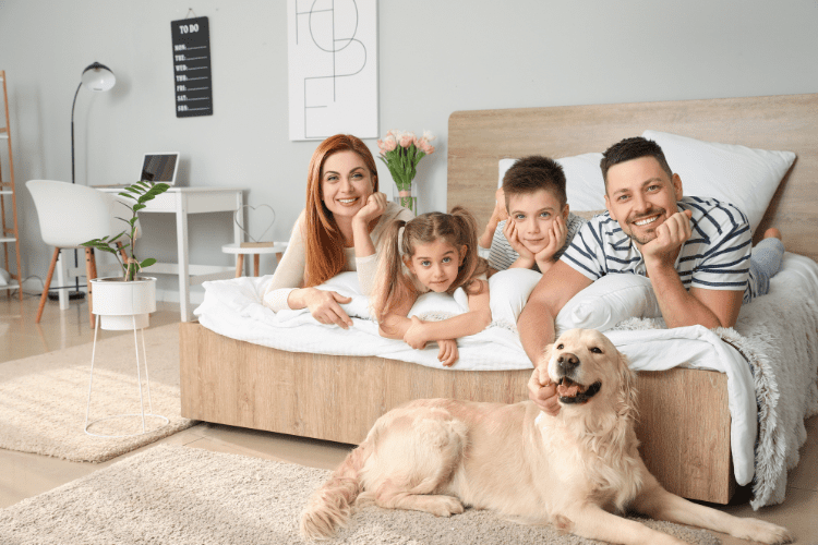 Family relaxing in comfortable home with dog