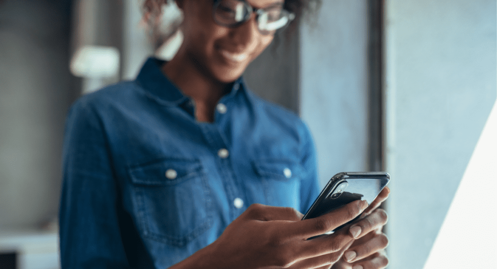 Woman using Smart Thermostat technology for your home